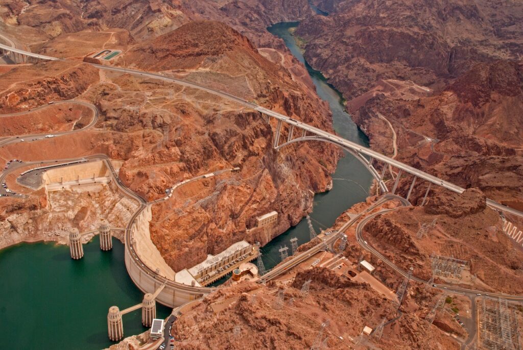 aerial view of Hoover Dam and The Mike O'Callaghan–Pat Tillman Memorial Bridge